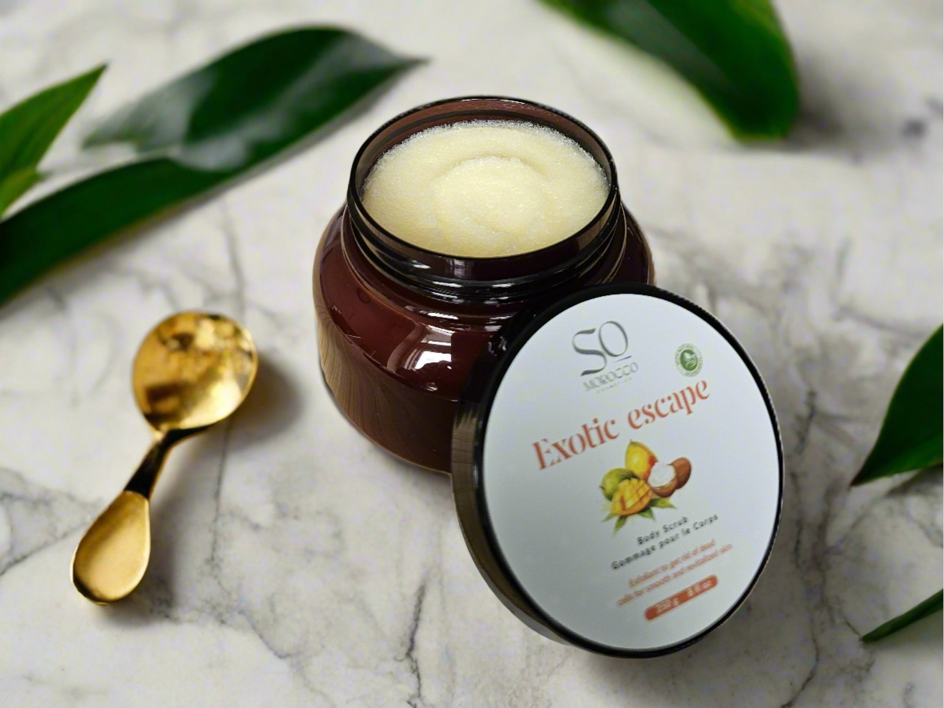 Gentle body scrub features nourishing Mango, Shea, and Cocoa Butters, alongside hydrating Avocado and Jojoba Oils. 